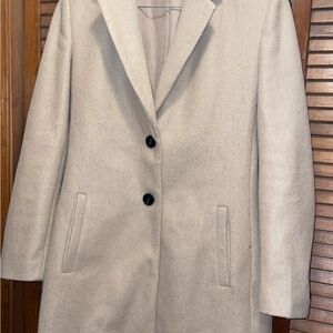 Elegant Cream Coat with Black Buttons